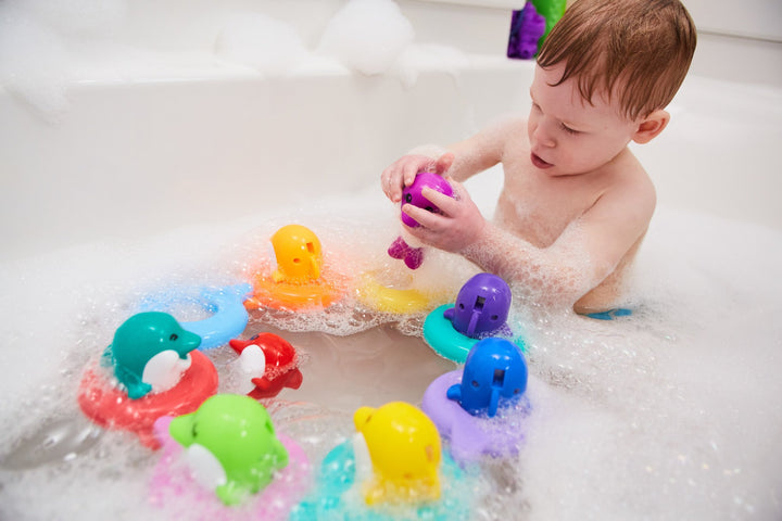 Juguete de baño para bebé Tomy Toomies Do Re Mi Dolphins | Juguete educativo y musical para niños pequeños